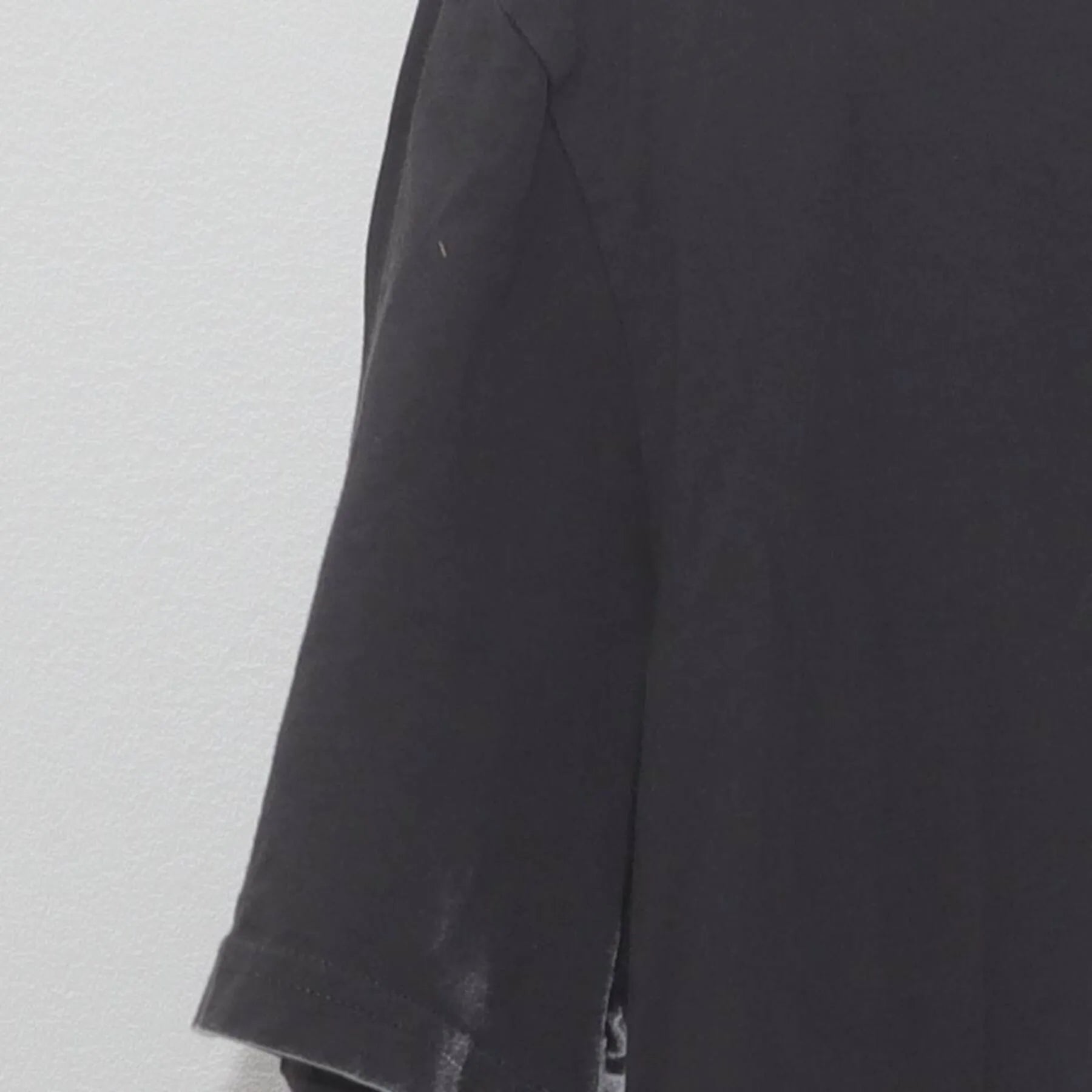 Left sleeve detail of Vintage Yiddish Book Center Goat Graphic T-Shirt Charcoal Gray