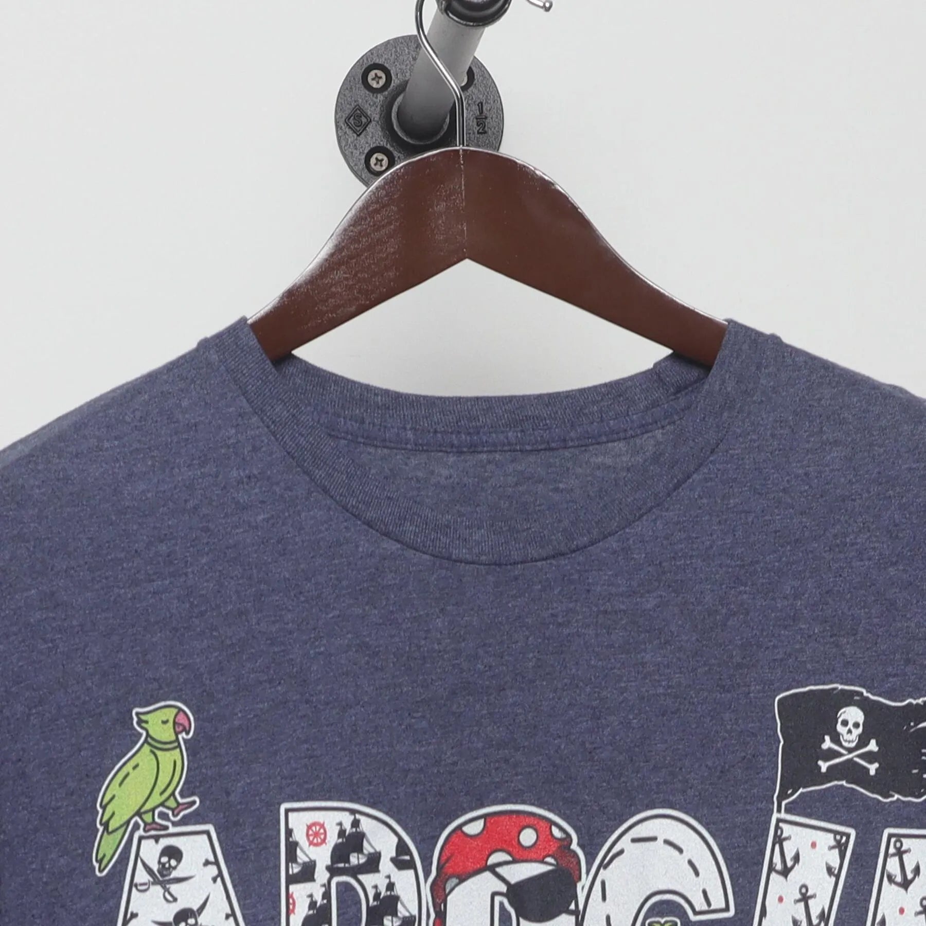 Collar and tag of ARRGH Pirate Graphic T-Shirt Heather Blue Jolly Roger Parrot Tee