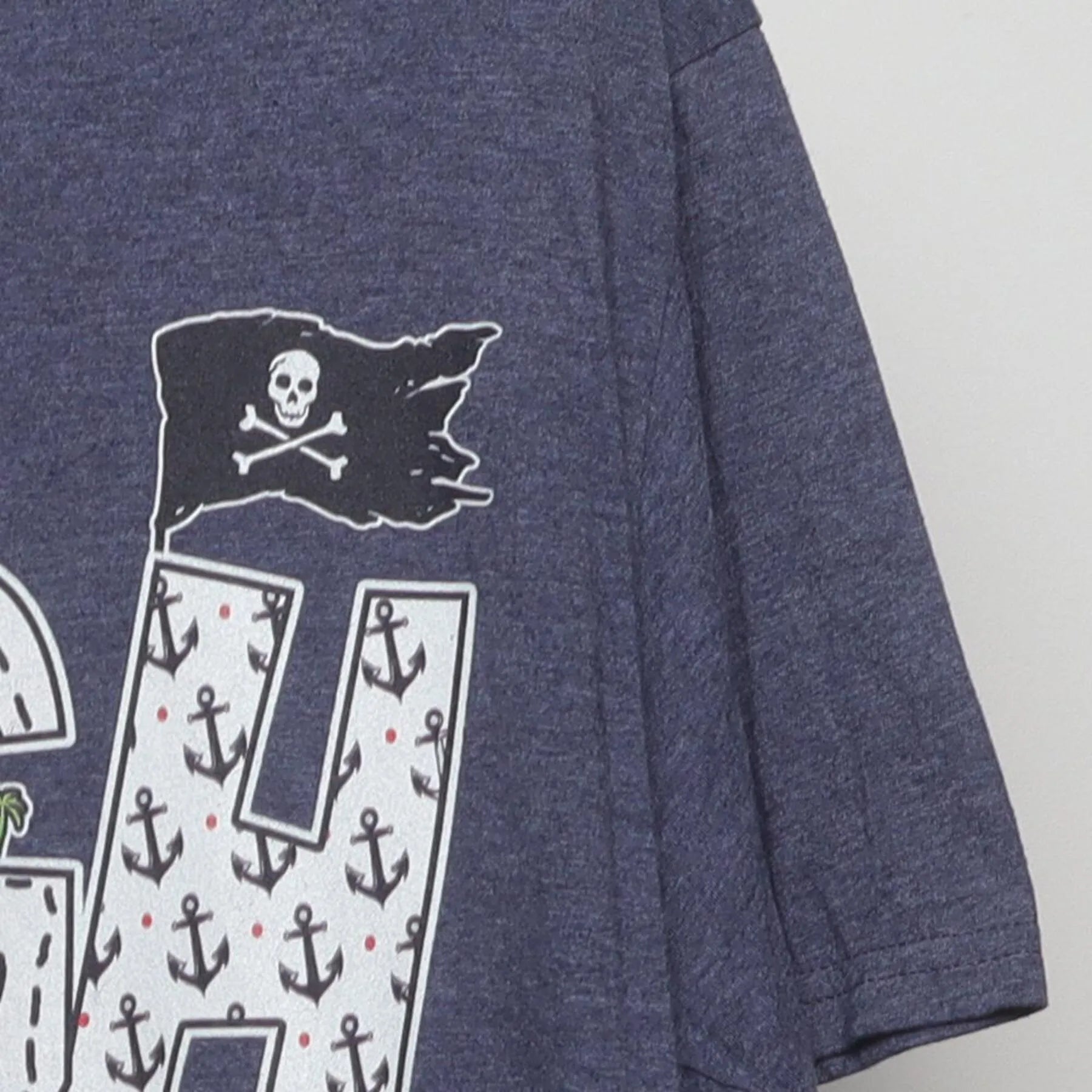 Right sleeve detail of ARRGH Pirate Graphic T-Shirt Heather Blue Jolly Roger Parrot Tee