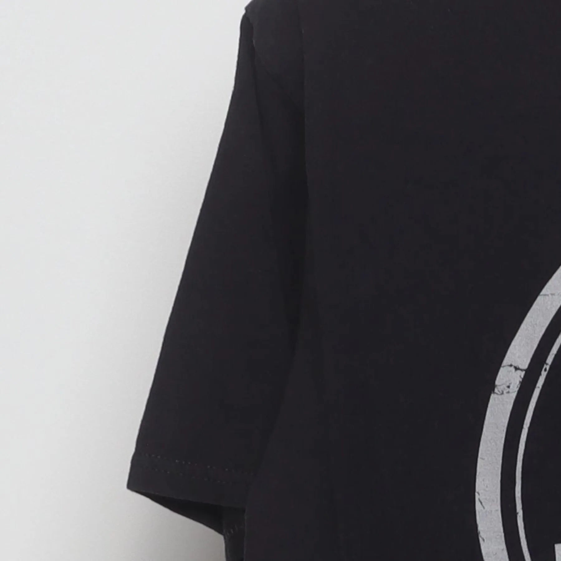 Left sleeve detail of Vintage "Stay Grounded" Electrical Symbol Graphic T-Shirt