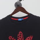Close-up of the collar and tag on the Vintage Y2K Adidas "Red Leopard Trefoil Logo" T-Shirt - XL