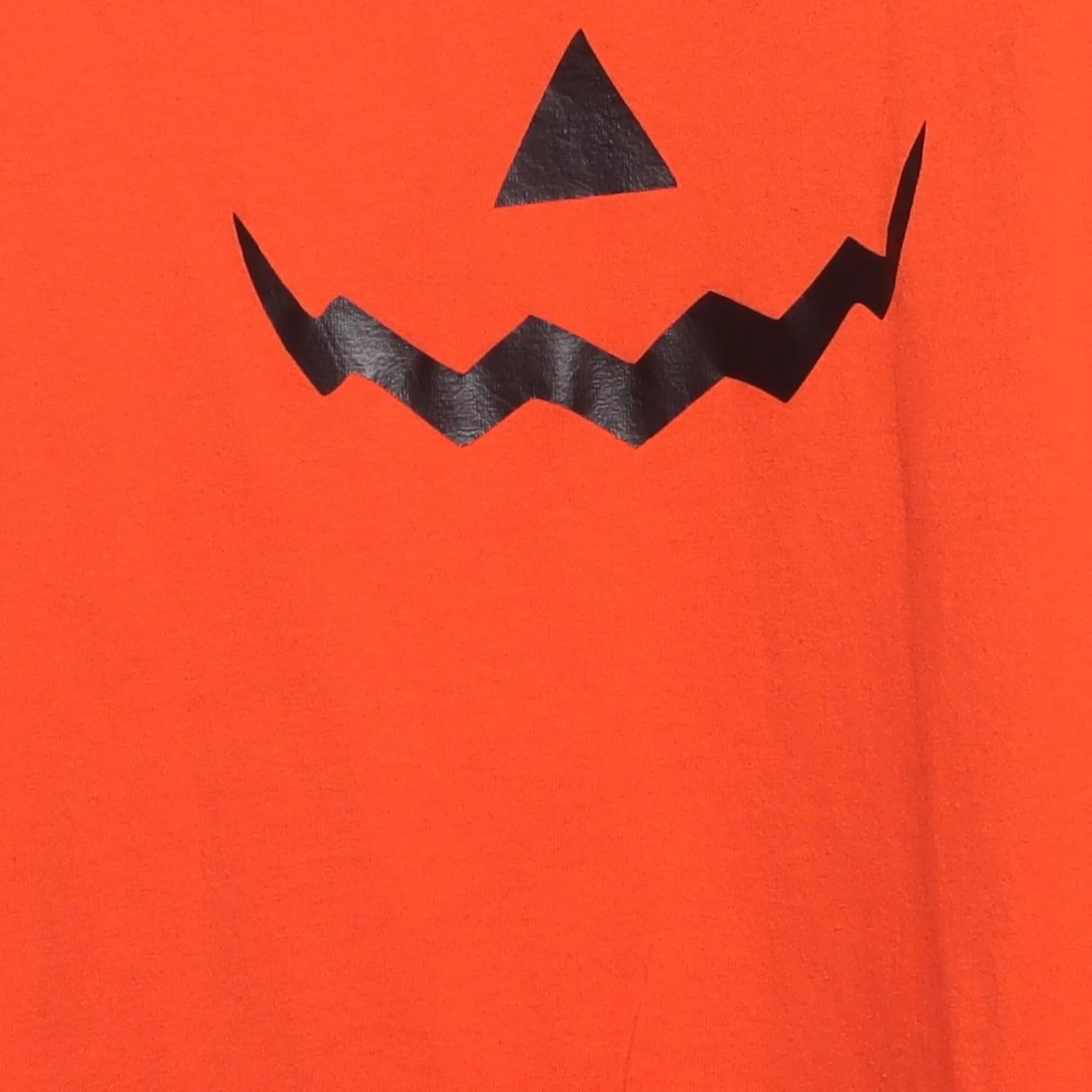 Close-up of the main graphic on the Vintage Y2K Halloween "Jack-O'-Lantern Face" T-Shirt - S