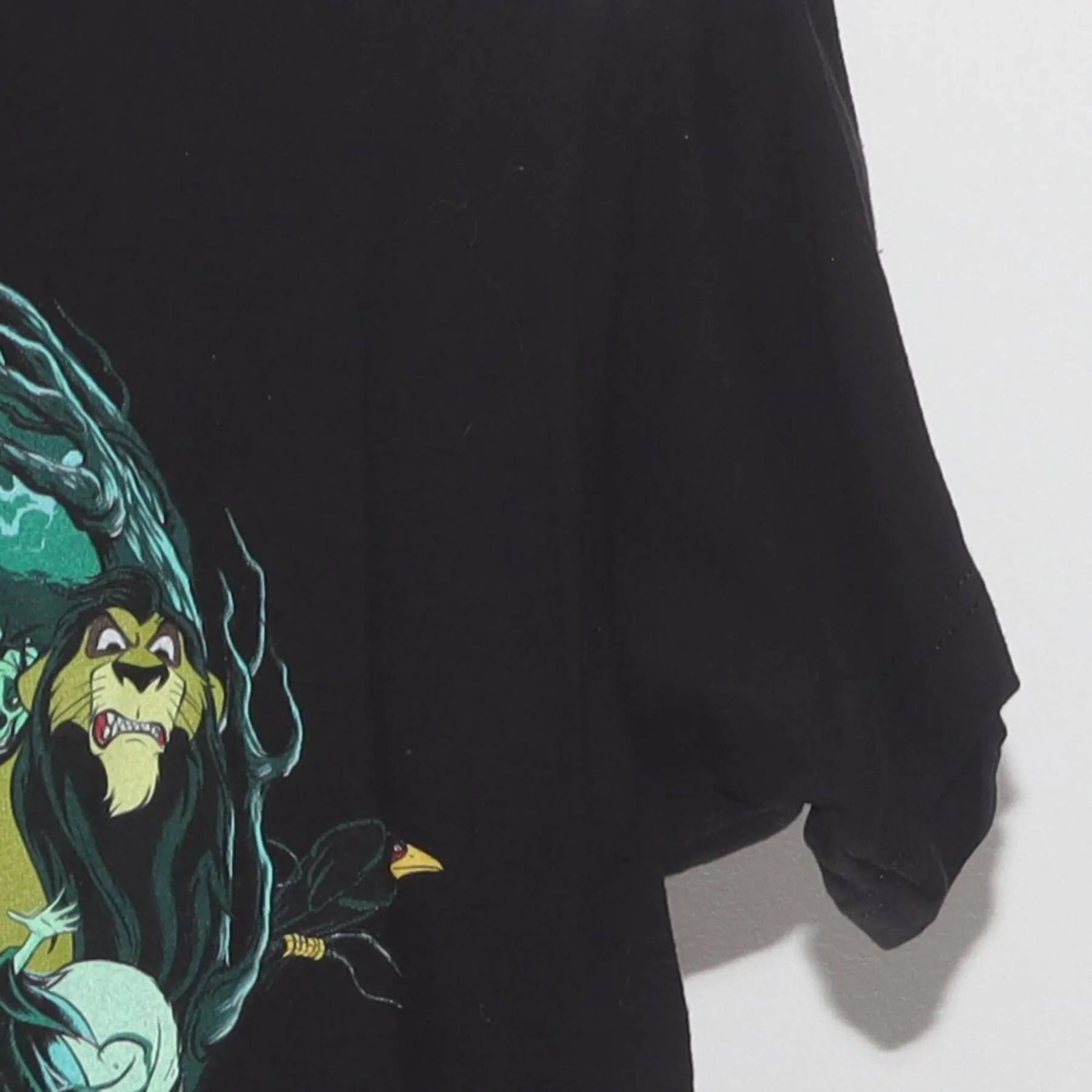 Close-up of the Right sleeve on the Vintage Y2K Disney "Villains Skull" T-Shirt - XS