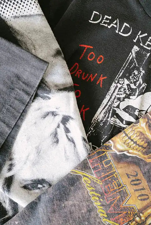 Stack of one-of-a-kind true vintage t-shirts with a Dead Kennedys shirt. Links to the Faded Vibes True Vintage collection.