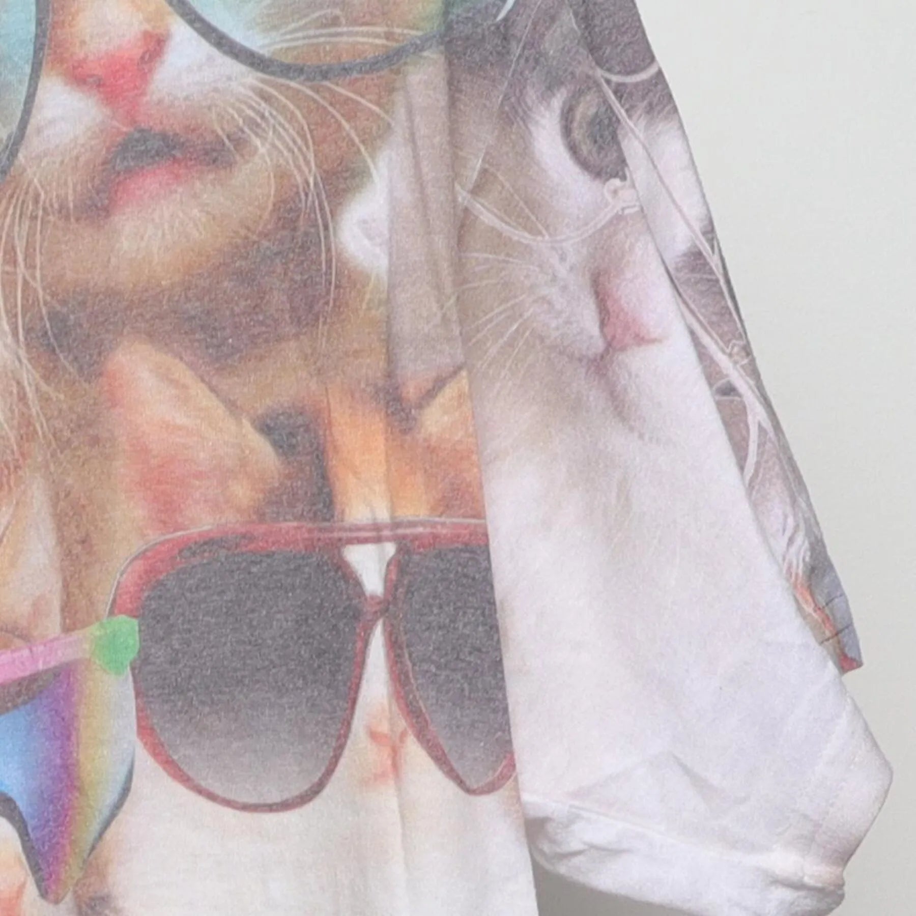 Close-up of the Right sleeve on the Vintage Y2K-Era The Mountain "Cats in Sunglasses" All Over Print T-Shirt - M