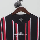 Close-up of the collar and tag on the Vintage Y2K Hollister "Vertical Stripe Logo" T-Shirt - M
