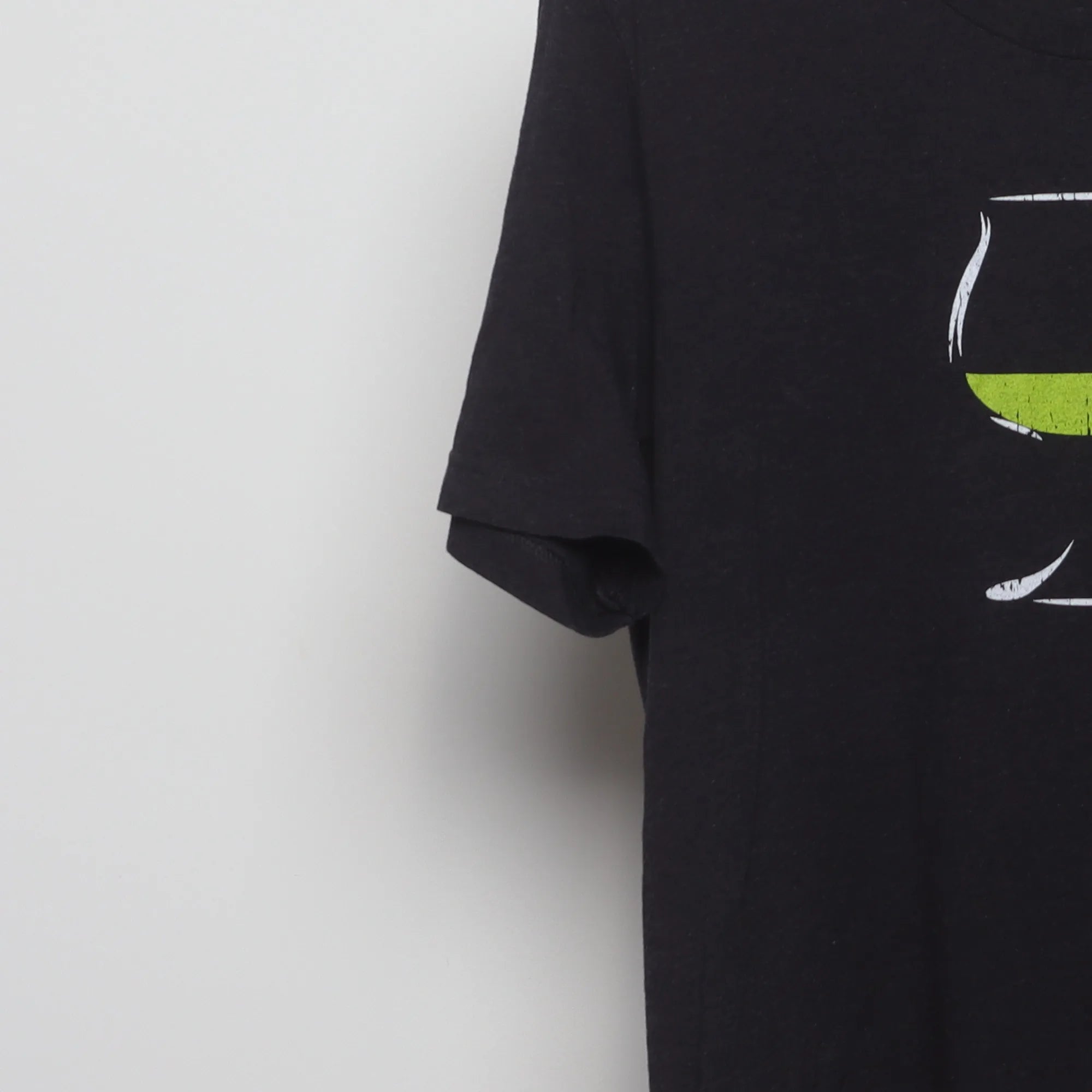 Close-up of the sleeve on the Modern Chartreuse Liqueur Graphic T-Shirt L
