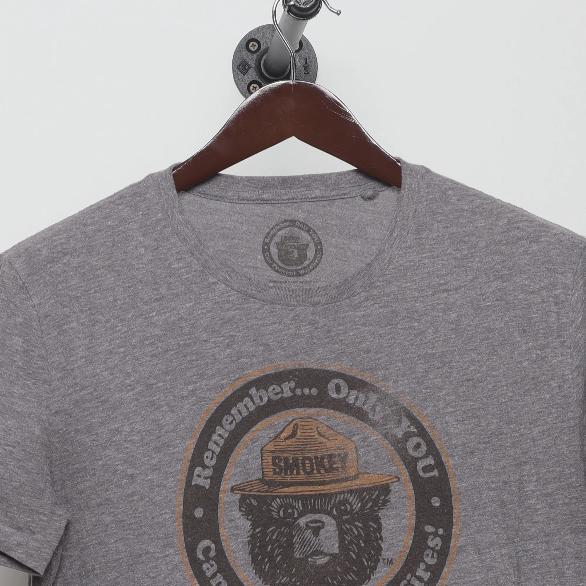 Close-up of the collar and tag on the Modern Smokey Bear Retro Graphic T-Shirt M