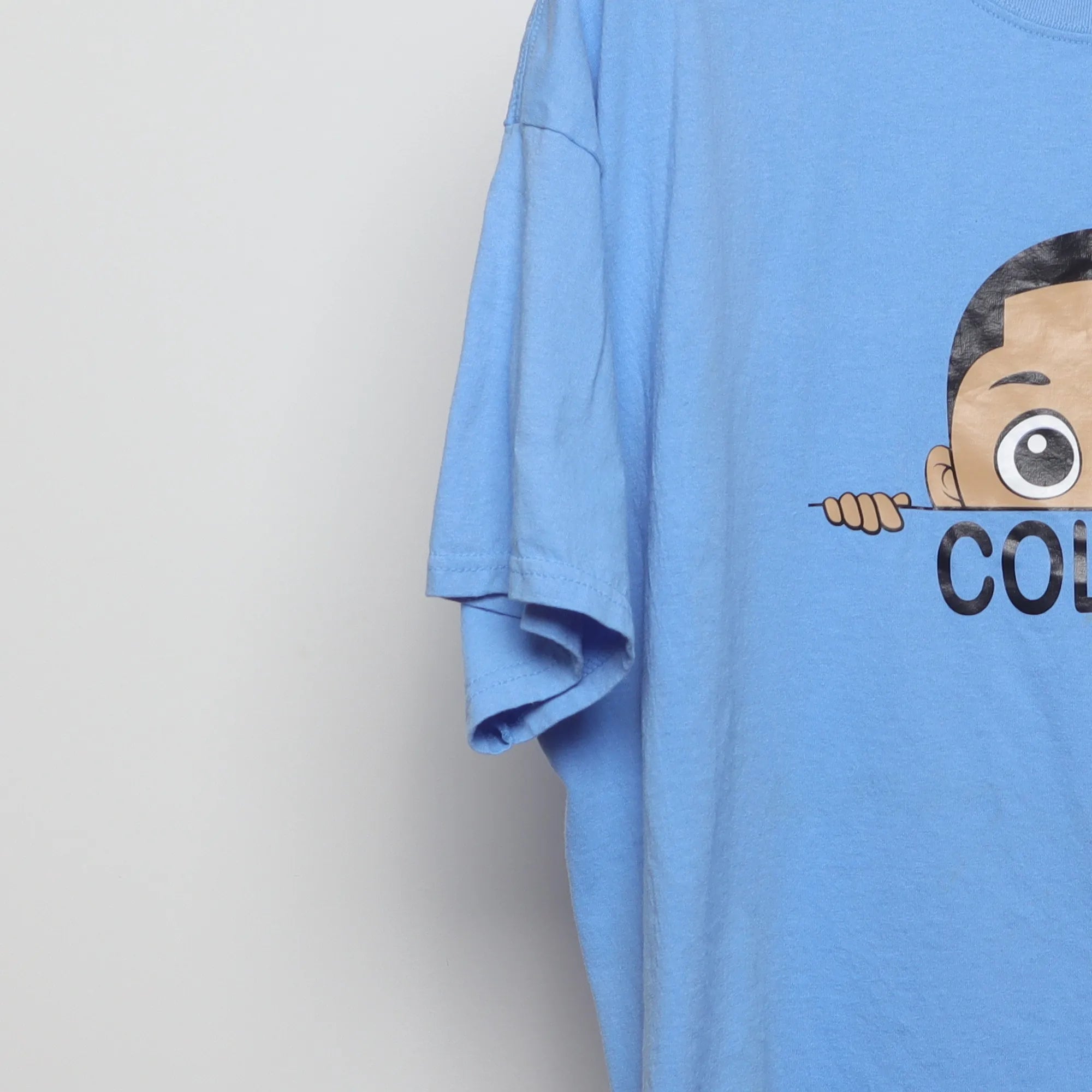 Close-up of the sleeve on the Modern Y2K Style Colton Cartoon Graphic T-Shirt XL