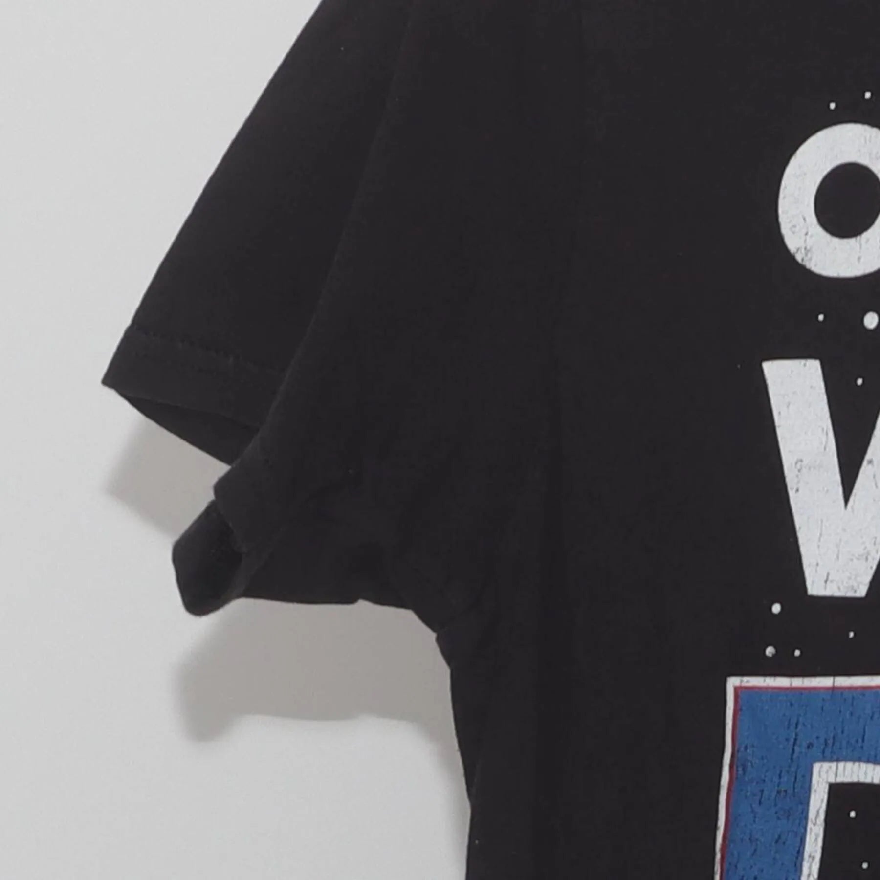 Close-up of the Left sleeve on the Vintage Y2K NASA "Out Of This World Dad" T-Shirt - S
