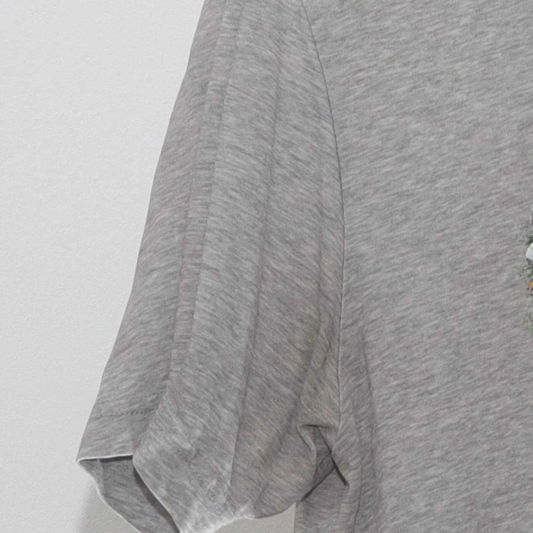 Close-up of the Left sleeve on the Vintage Y2K Nike "Photo Collage Swoosh" T-Shirt - M