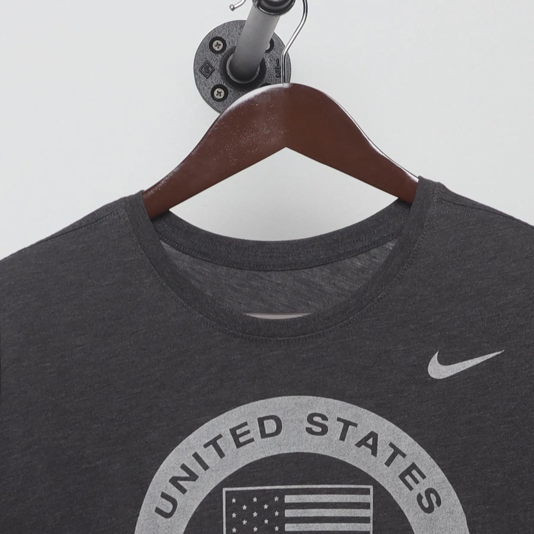 Close-up of the collar and tag on the Vintage Y2K Nike "United States Olympic Team" T-Shirt - L