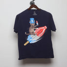 Front view of Vintage Y2K Celebrate! Patriotic "Cat Riding Rocket Pop" T-Shirt - M