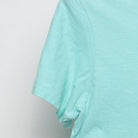 Close-up of the Left sleeve on the Vintage Y2K Quiksilver "Crest Logo" T-Shirt - S