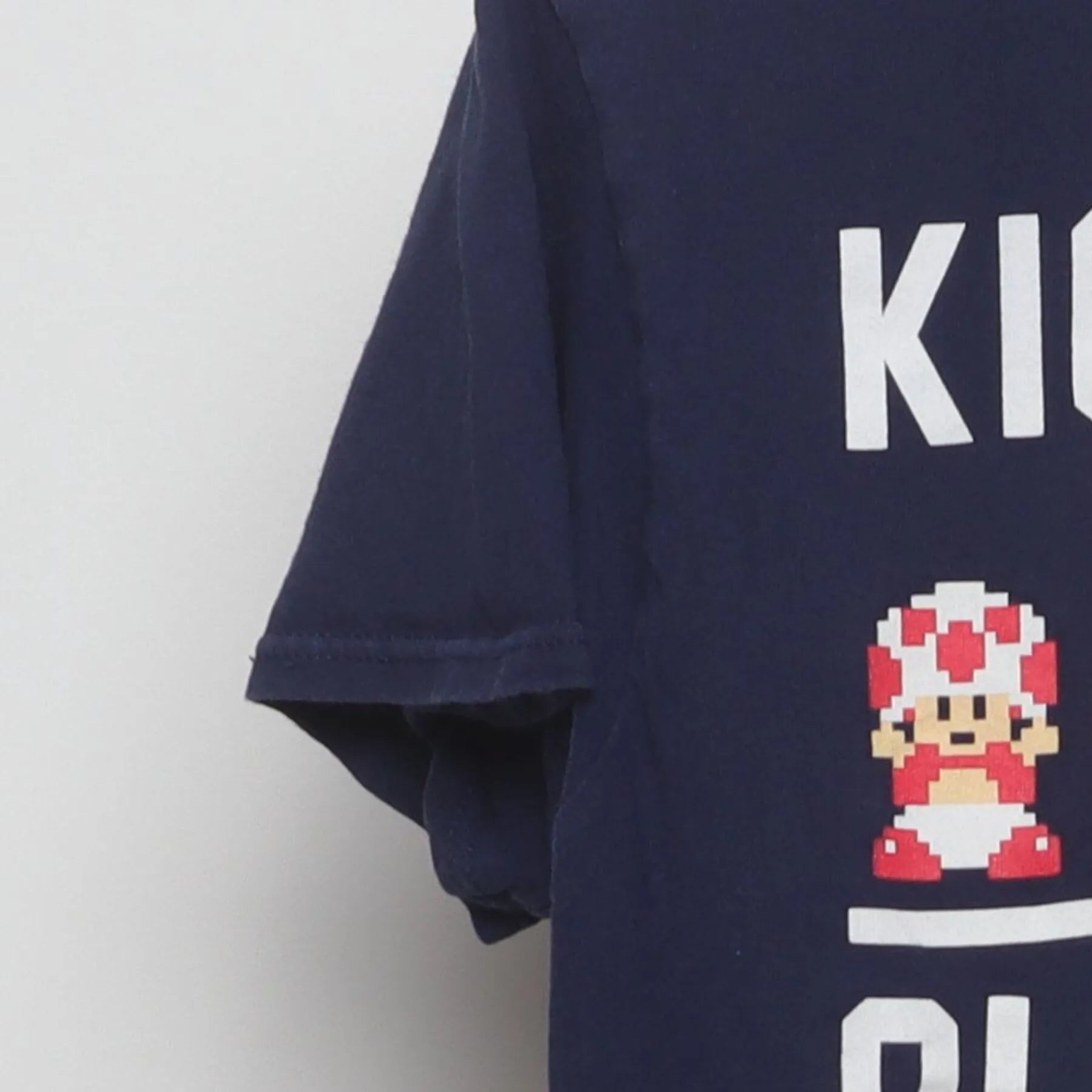 Close-up of the Left sleeve on the Vintage Y2K Super Mario Bros. "Kickin It Old School" T-Shirt - S
