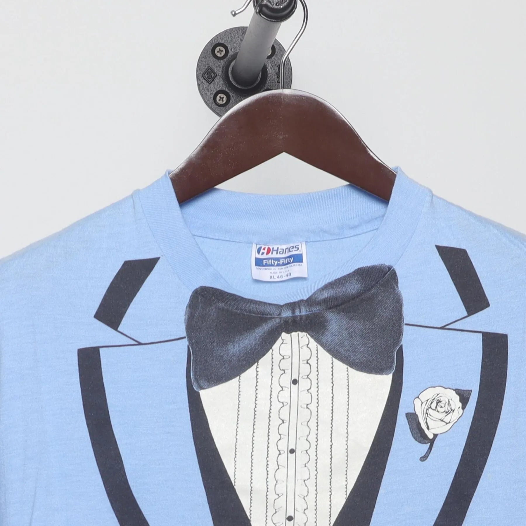 Close-up of the collar and tag on the Vintage 1980s Roach "Tuxedo" T-Shirt - M