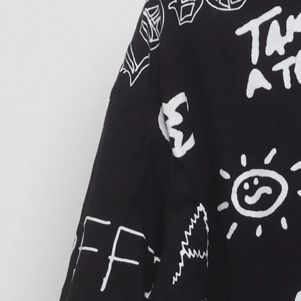 Close-up of the sleeve on the Vintage 1990s Graffiti Art "Chaos & Peace" All Over Print T-Shirt - XXL