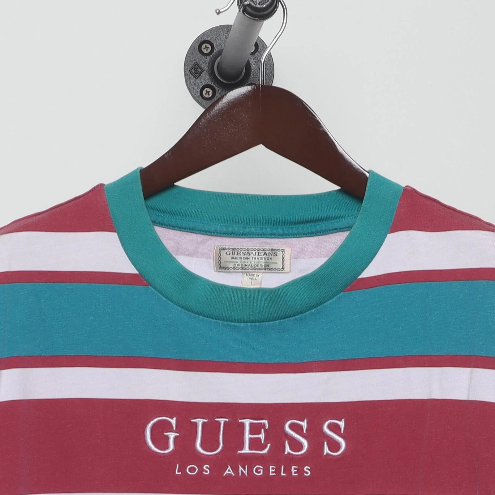 Close-up of the collar and tag on the Vintage 1990s Guess "Striped Logo" T-Shirt - XL
