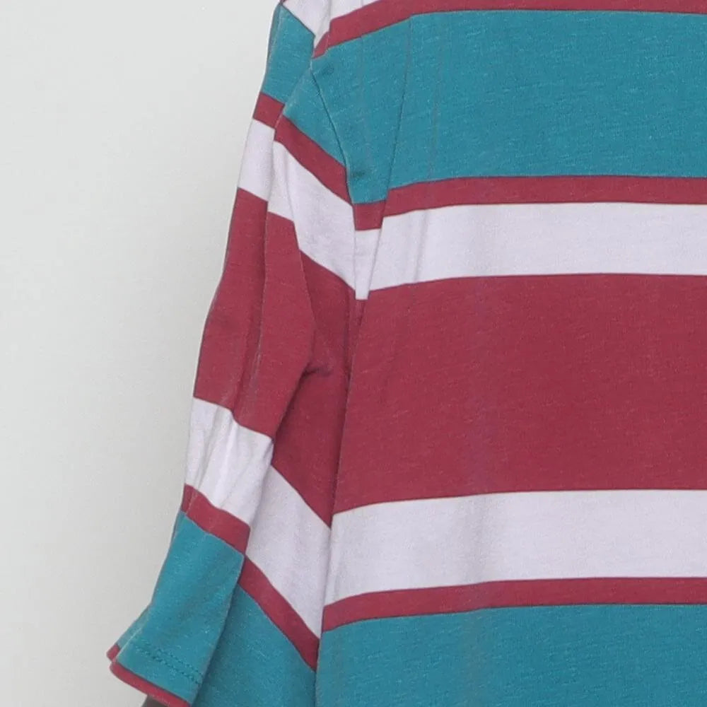 Close-up of the sleeve on the Vintage 1990s Guess "Striped Logo" T-Shirt - XL