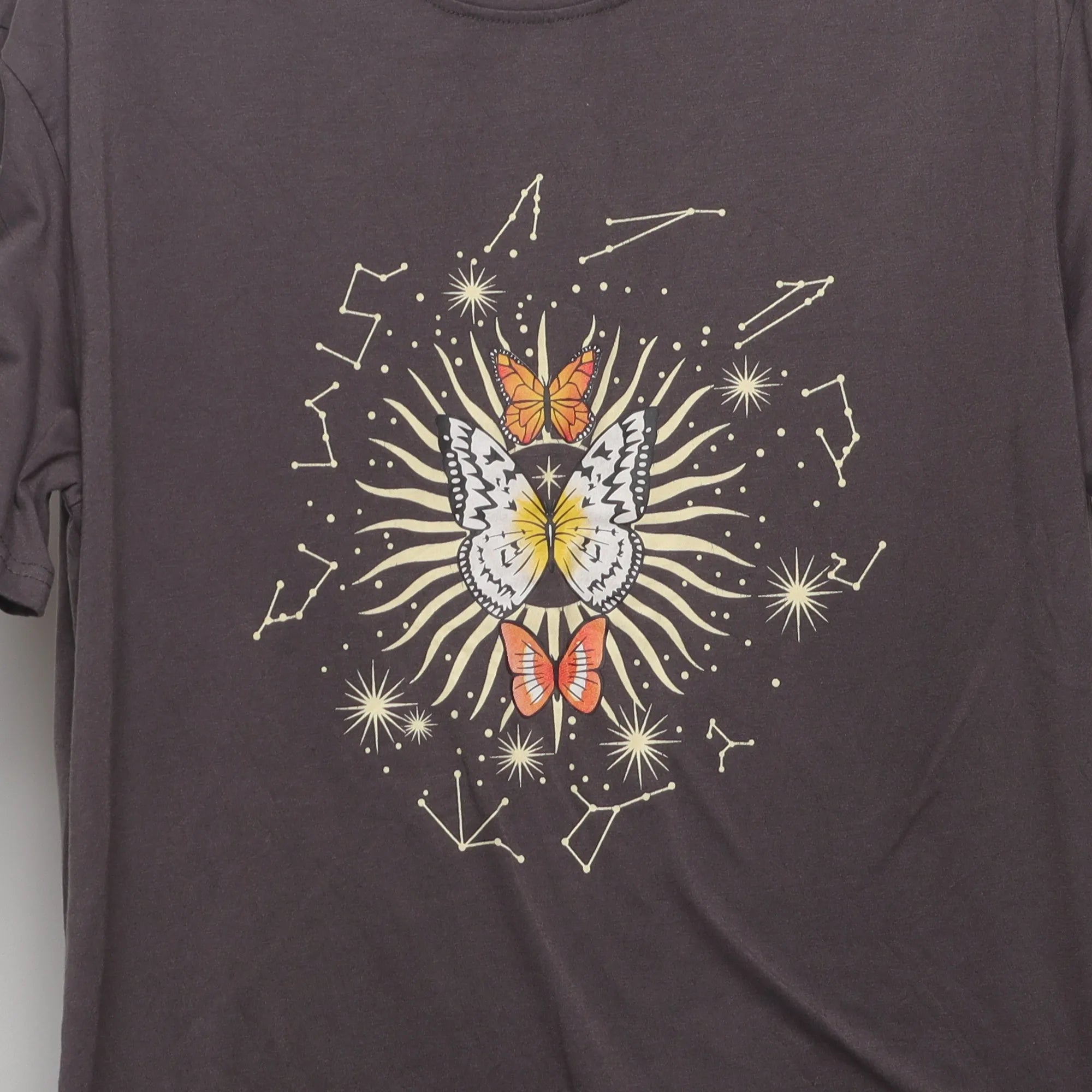 Close-up of the main graphic on the Vintage 2000s Celestial Butterfly Graphic Tee M