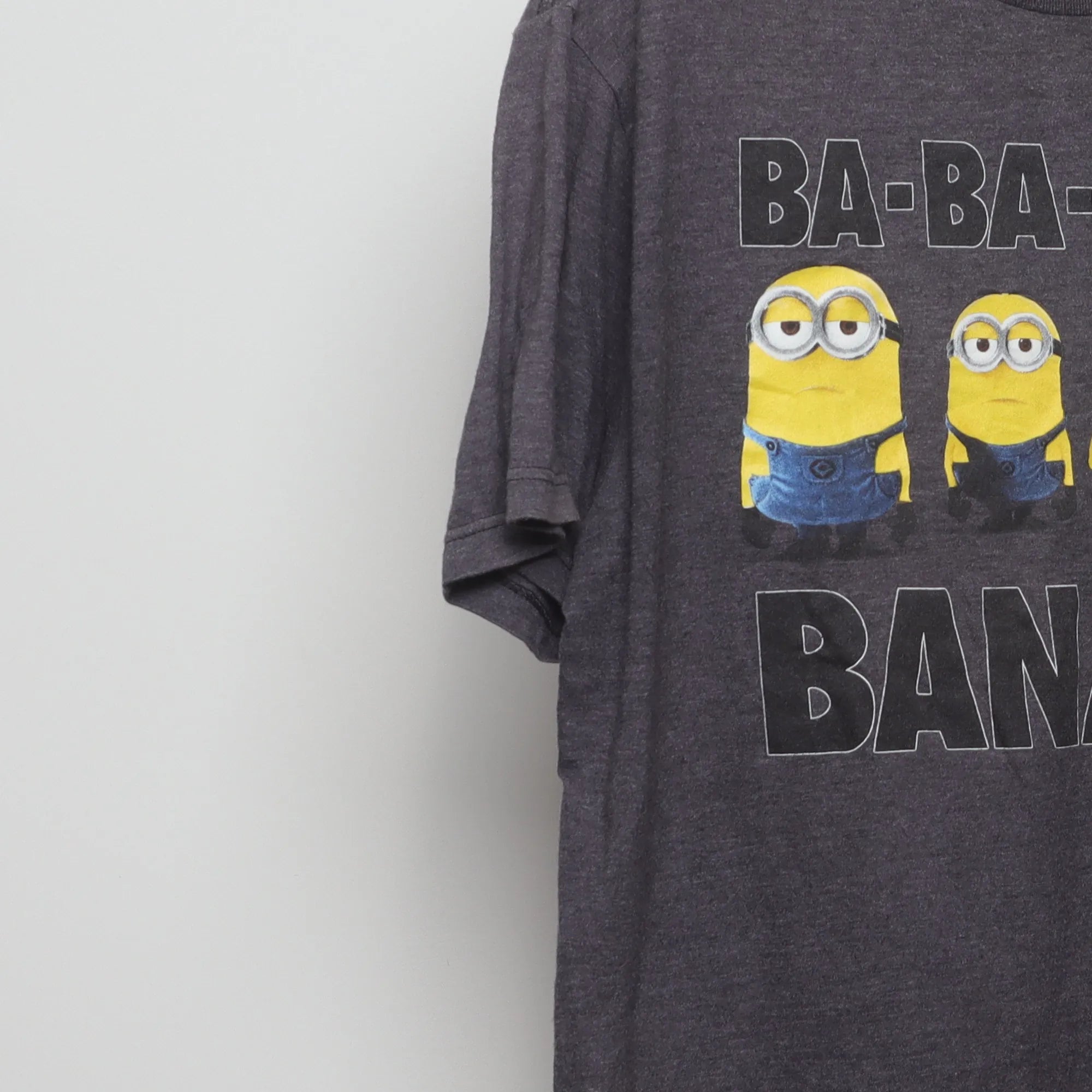 Close-up of the sleeve on the Vintage 2010s Despicable Me Minions Banana T-Shirt XL