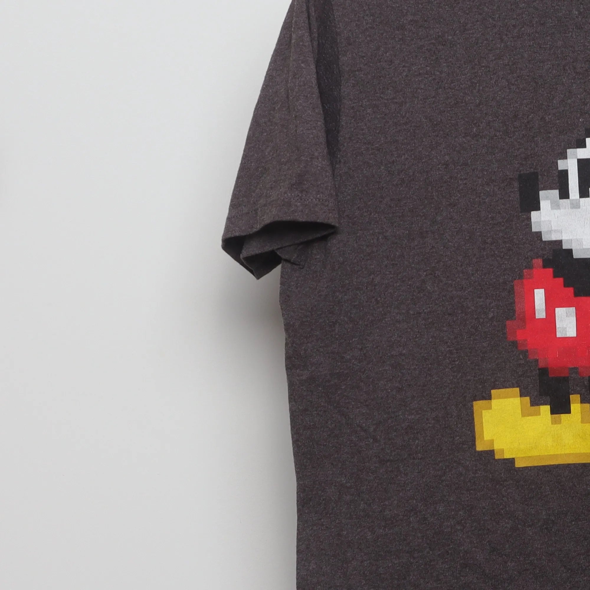Close-up of the sleeve on the Vintage 2010s Disney 8-Bit Mickey Mouse T-Shirt L