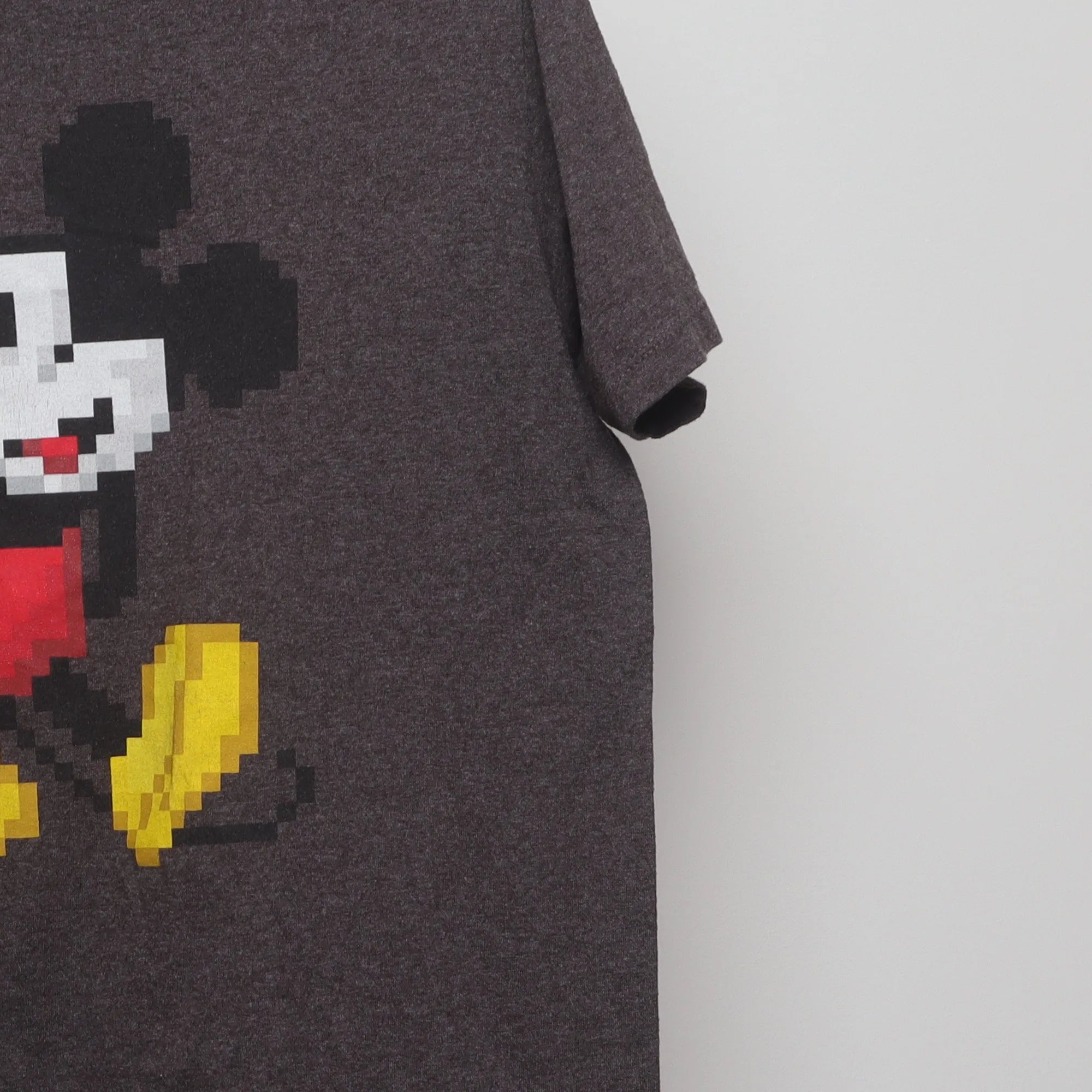 Close-up of the sleeve on the Vintage 2010s Disney 8-Bit Mickey Mouse T-Shirt L