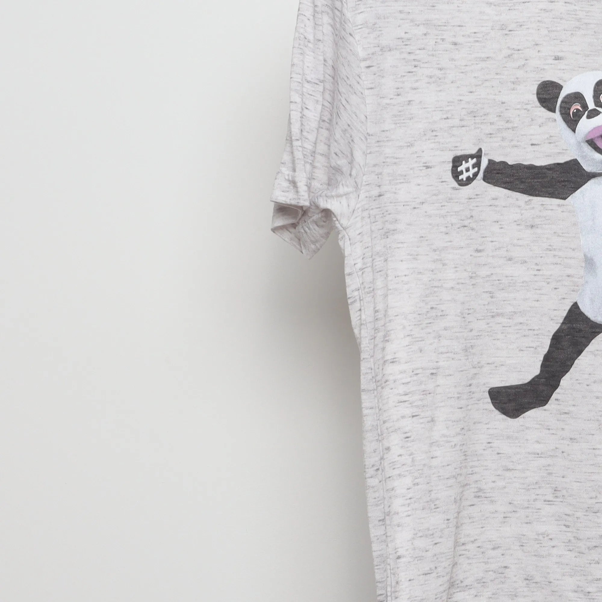 Close-up of the sleeve on the Vintage 2010s Jimmy Fallon Hashtag Panda T-Shirt S