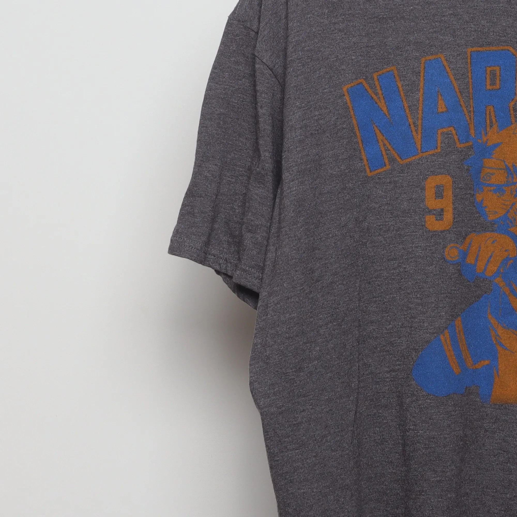 Close-up of the sleeve on the Vintage 2010s Naruto Anime Graphic T-Shirt XL