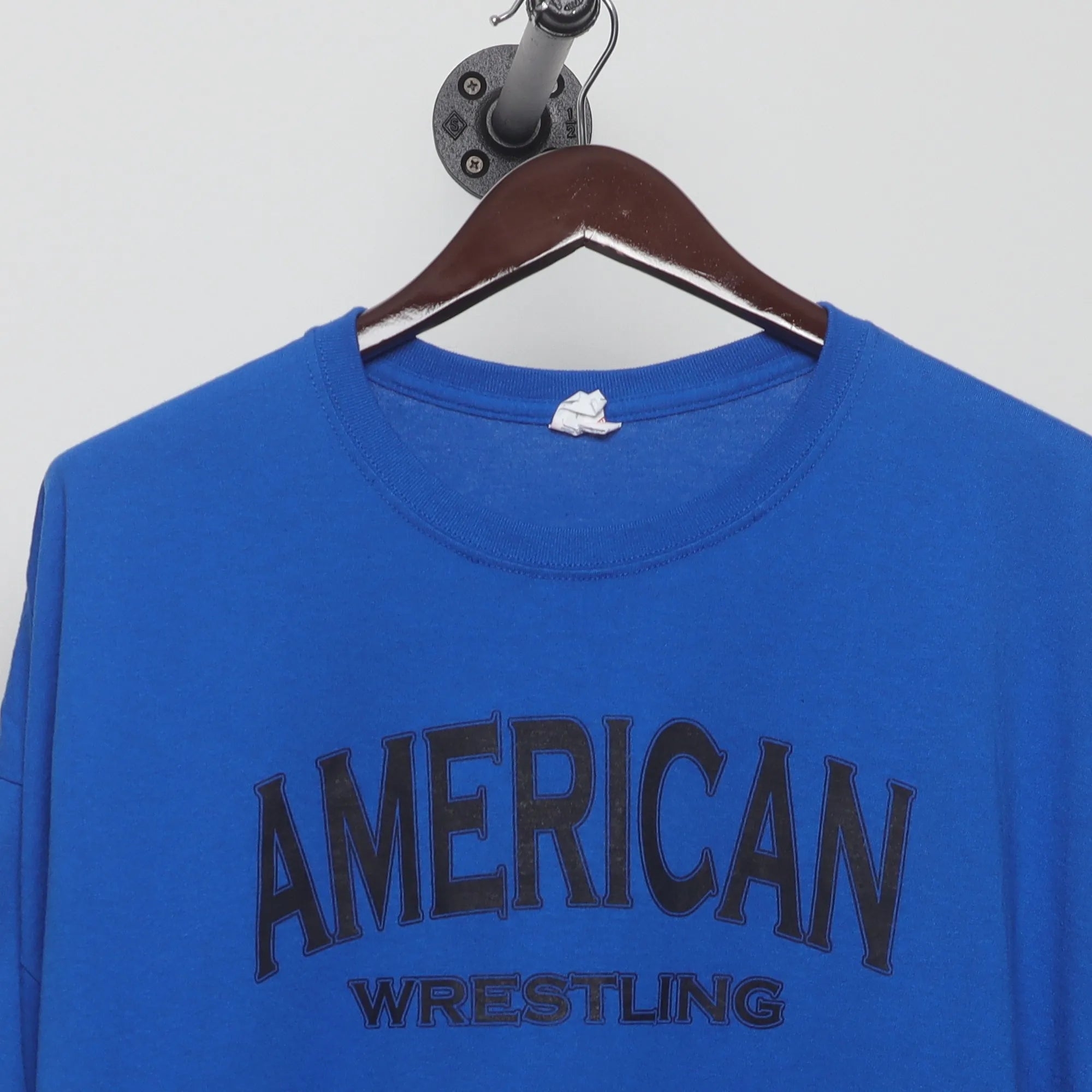 Close-up of the collar and tag on the Vintage 2010s NCAA Wrestling MSG Graphic Tee XXL