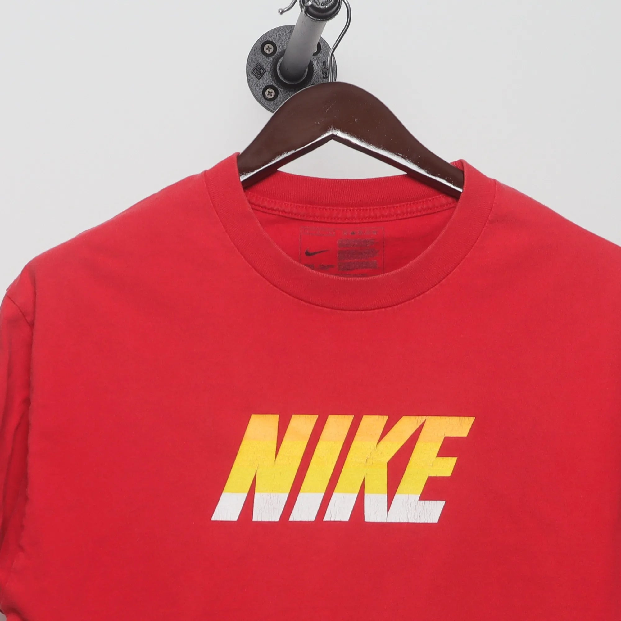 Close-up of the collar and tag on the Vintage 2010s Nike Block Logo Graphic T-Shirt L