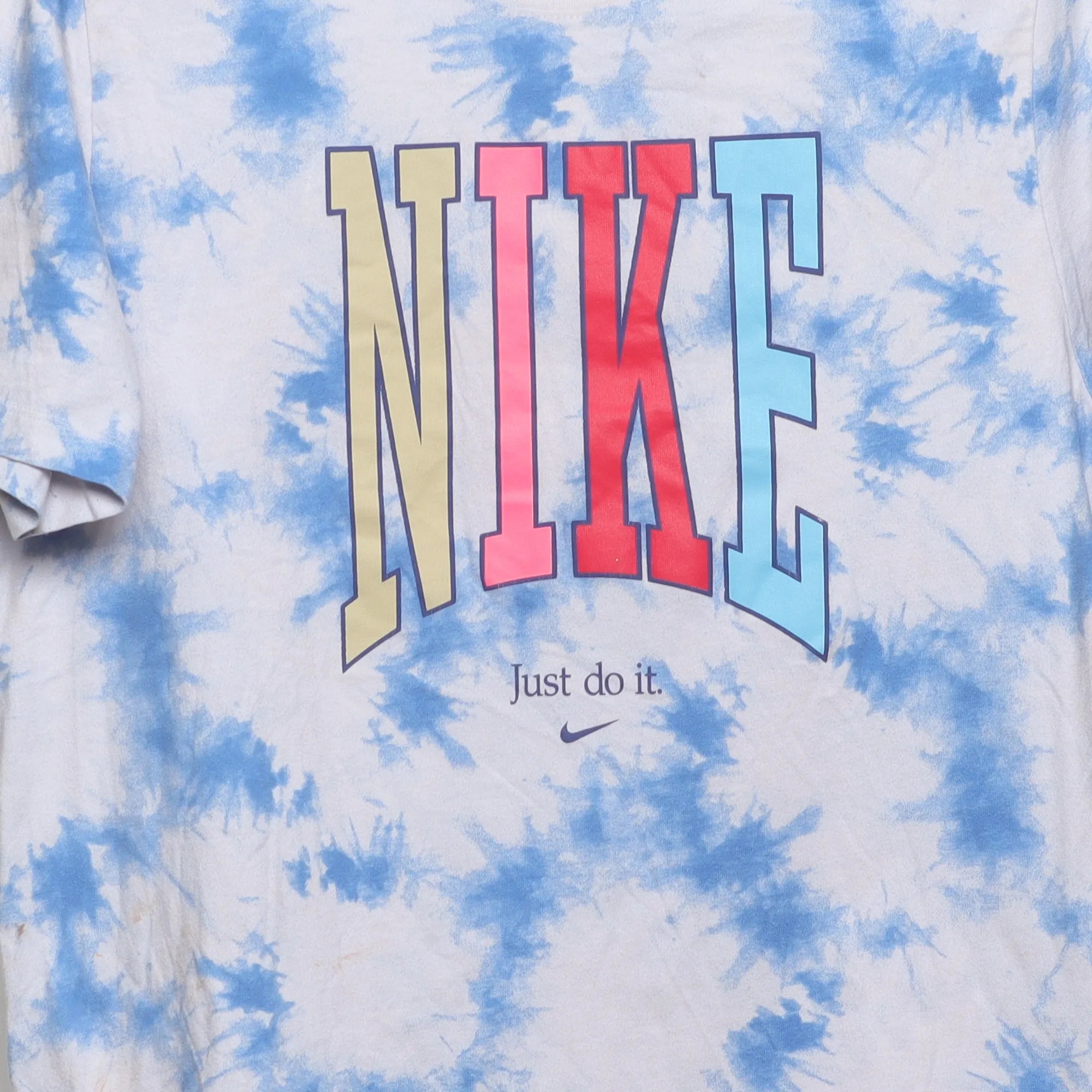 Close-up of the main graphic on the Vintage 2010s Nike Tie-Dye Peace Graphic Tee XL