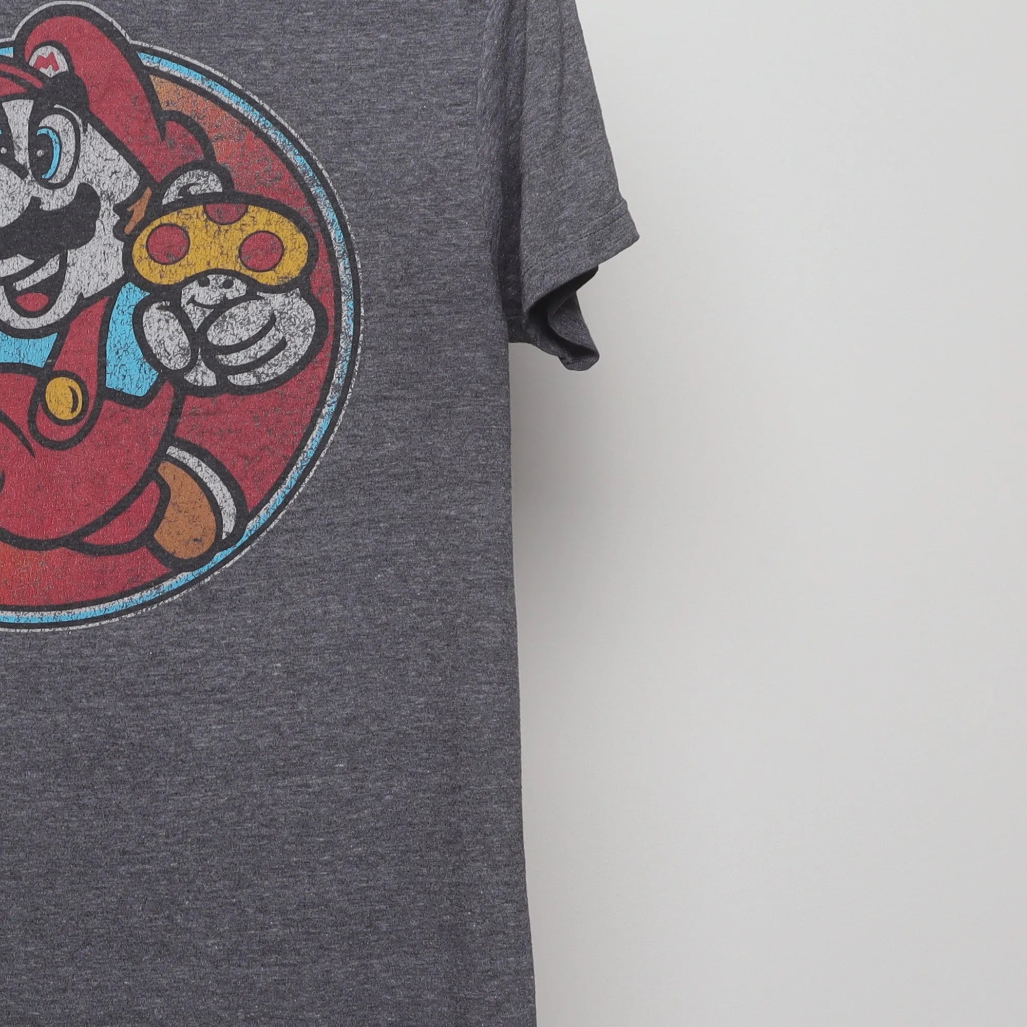 Close-up of the sleeve on the Vintage 2010s Super Mario Gamer Graphic T-Shirt S