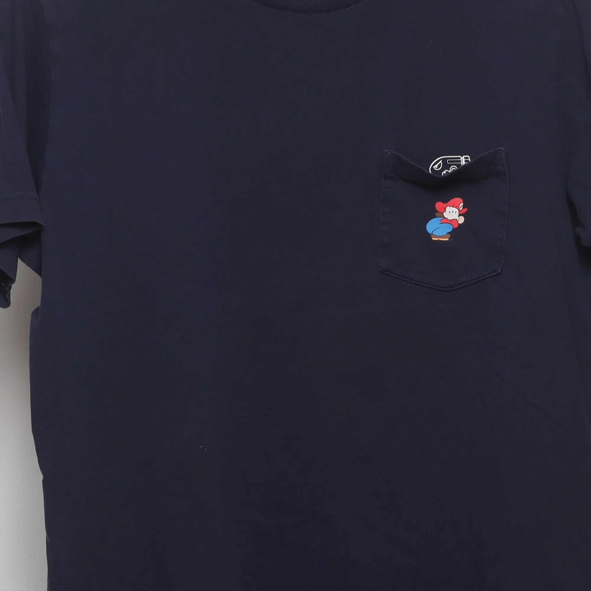 Close-up of the main graphic on the Vintage 2010s Uniqlo Nintendo Mario Pocket T-Shirt L