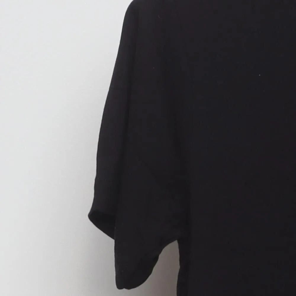 Close-up of the sleeve on the Vintage 2010s White Claw "Wave Logo" T-Shirt - S