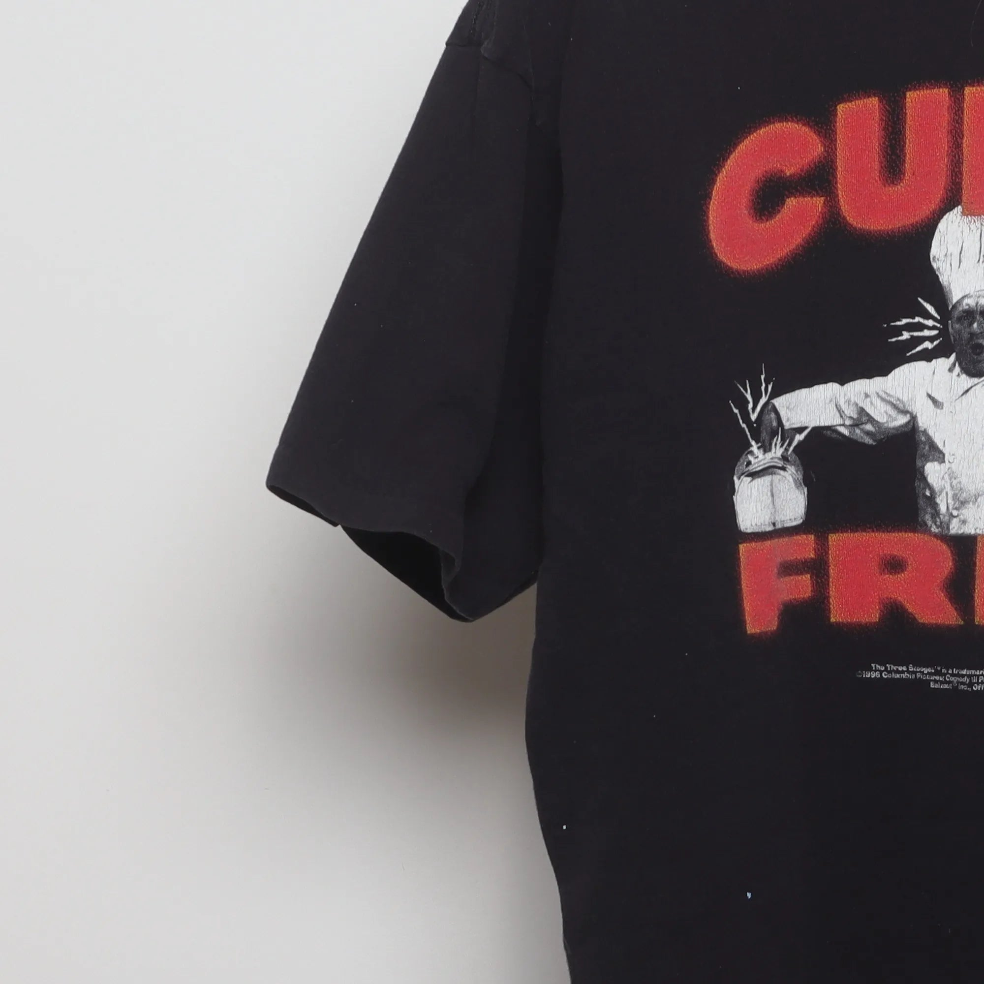 Close-up of the sleeve on the Vintage 90s Curly Fries Promo Graphic T-Shirt XL