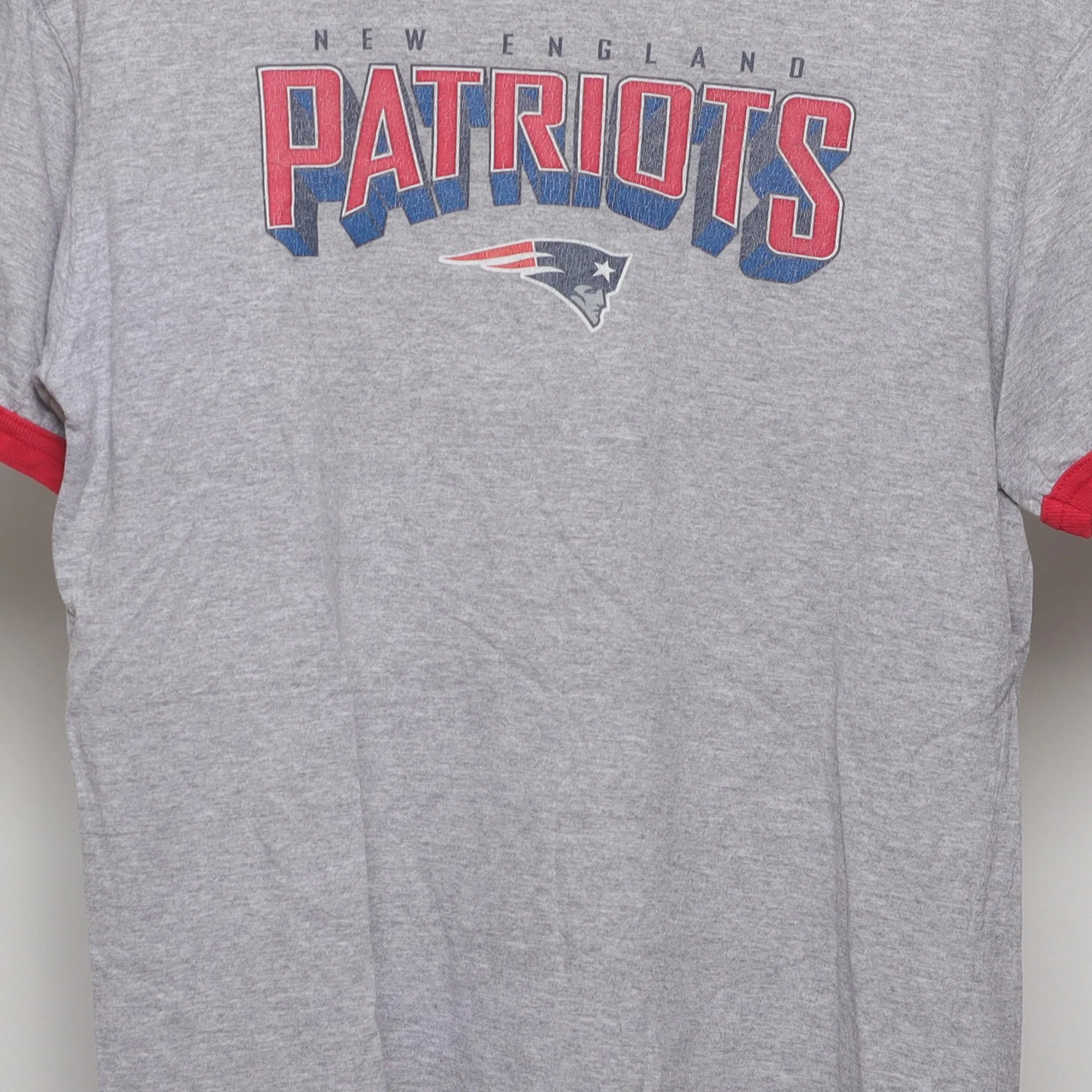 Close-up of the main graphic on the Vintage 90s New England Patriots Ringer T-Shirt M
