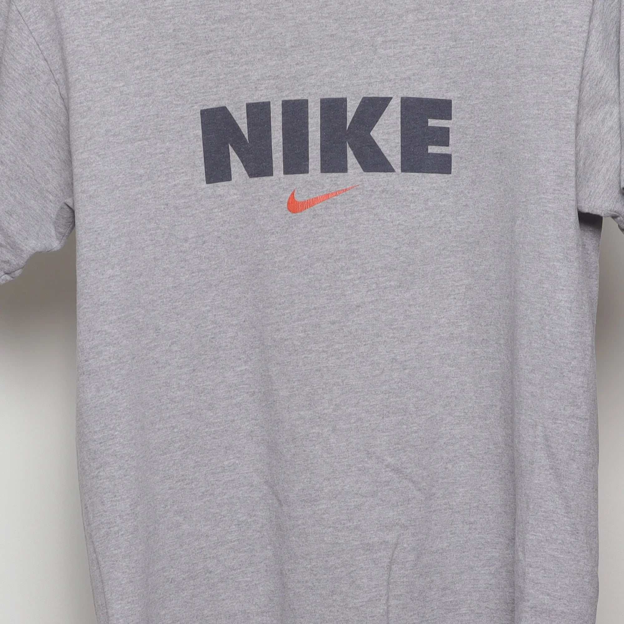 Close-up of the main graphic on the Vintage 90s Nike Block Logo Swoosh T-Shirt M