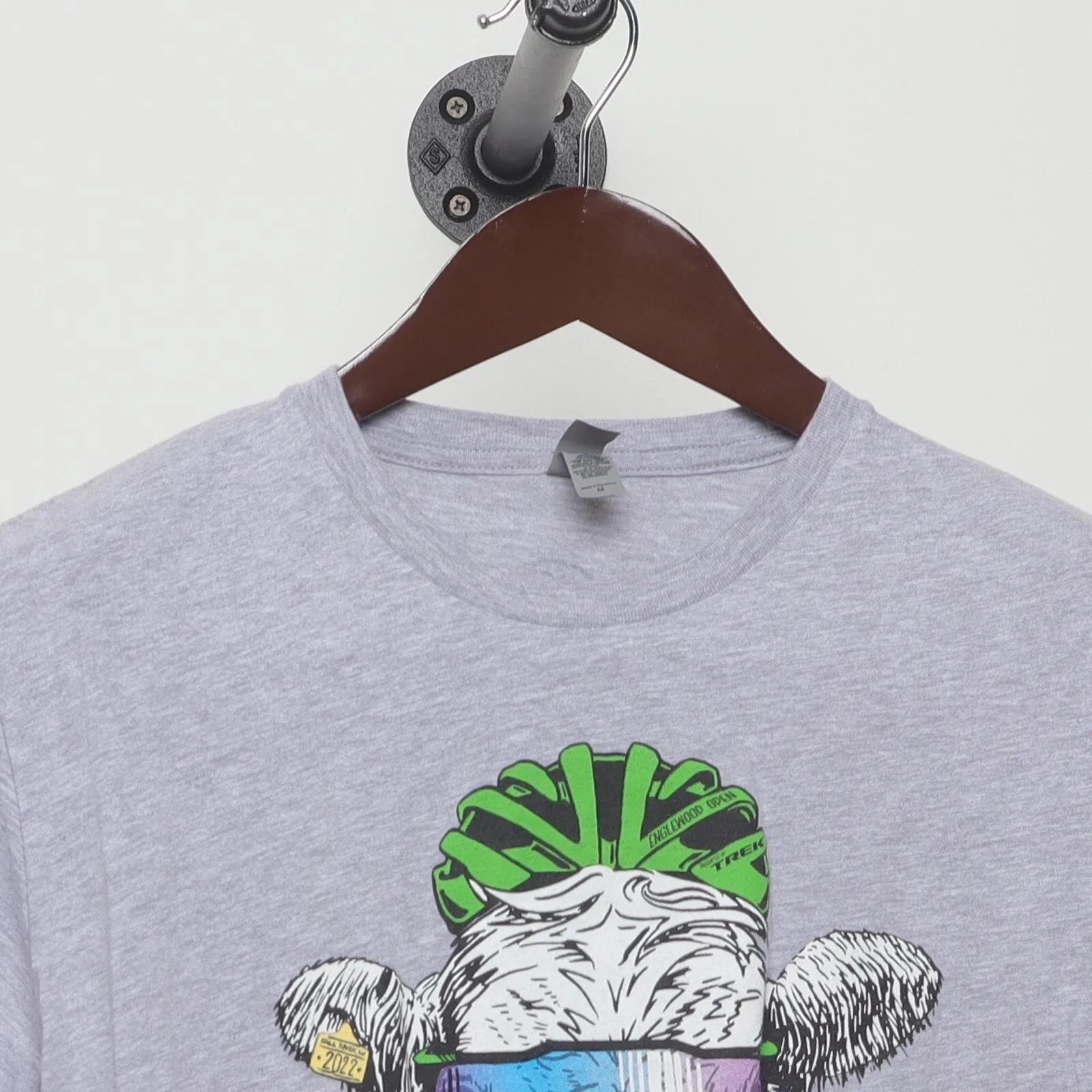 Close-up of the collar and tag on the Vintage Modern Englewood Grass Farm "Cycling Cow" T-Shirt - M