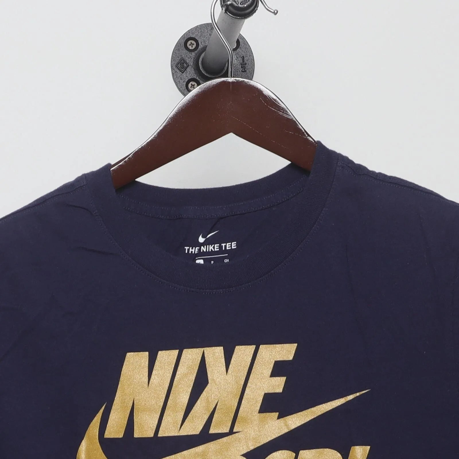 Close-up of the collar and tag on the Vintage Modern Nike "BSBL Gold Foil" T-Shirt - S