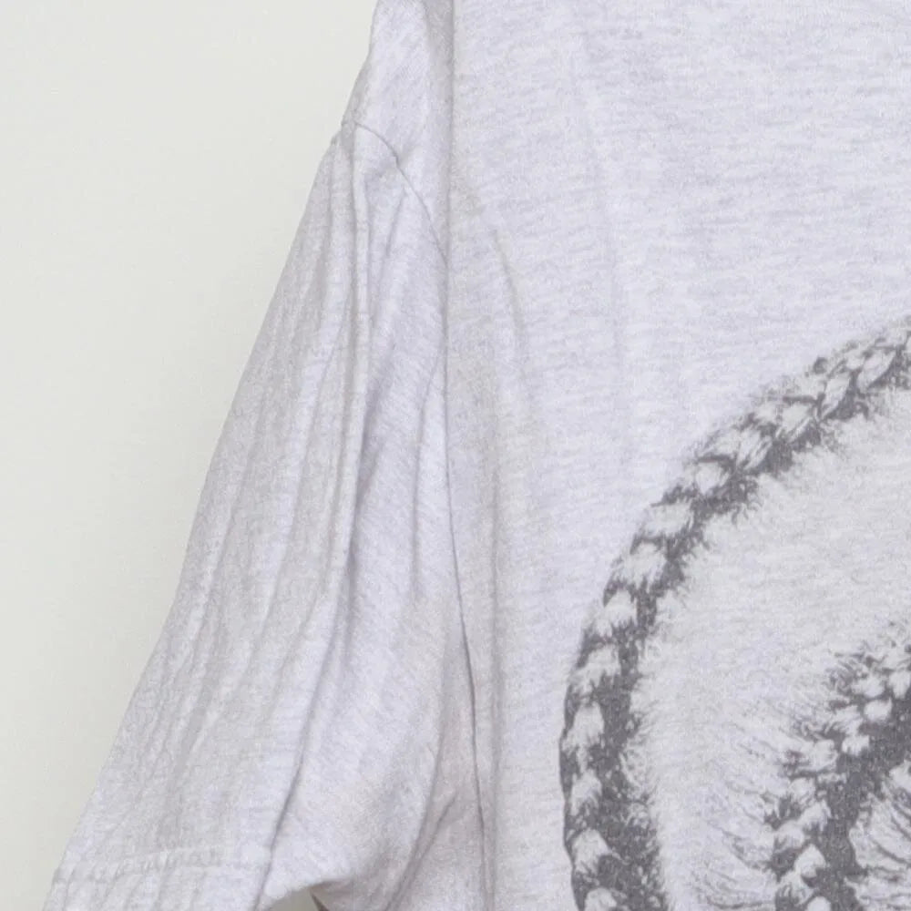 Close-up of the sleeve on the Vintage Modern Nipsey Hussle "Never Let A Hard Time Humble Us" T-Shirt - L