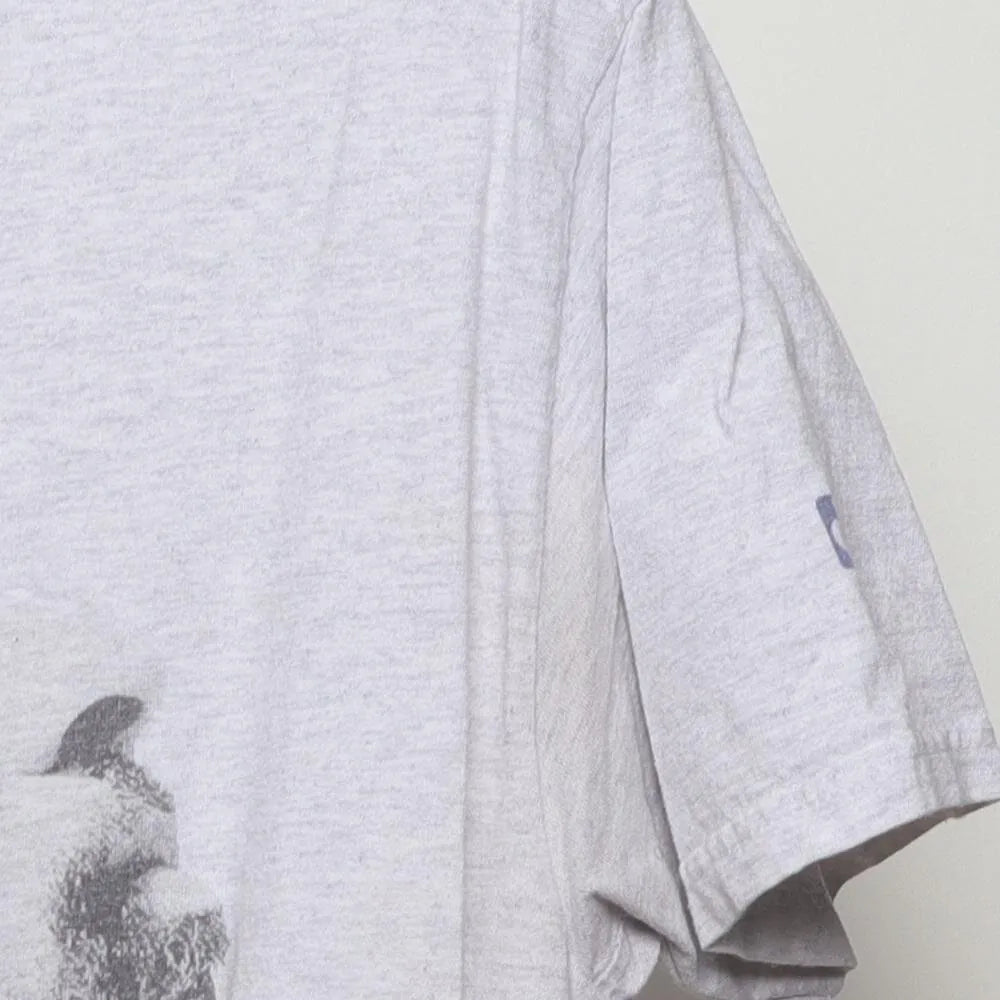 Close-up of the sleeve on the Vintage Modern Nipsey Hussle "Never Let A Hard Time Humble Us" T-Shirt - L