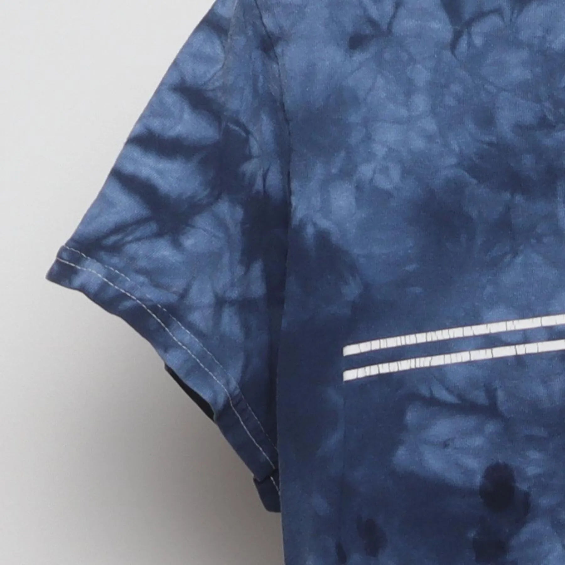 Close-up of the Left sleeve on the Vintage Y2K Santa Cruz Skateboards "Classic Dot Logo Tie-Dye" T-Shirt - S