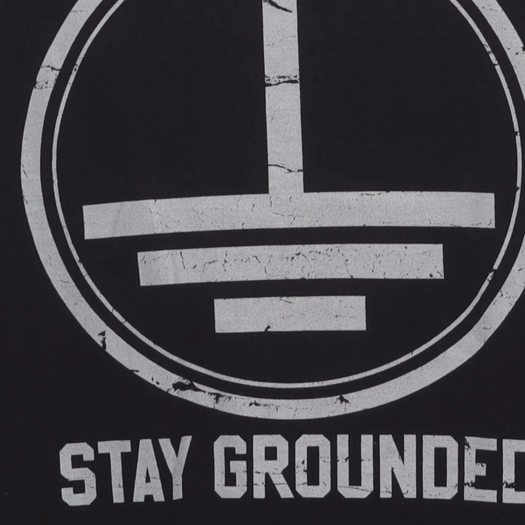 Close-up of the Right sleeve on the Vintage Y2K Graphic "Stay Grounded" T-Shirt - L