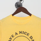 Close-up of the collar and tag on the Vintage 1970s walk in love. "Have A Nice Day" Smiley Face T-Shirt - XS