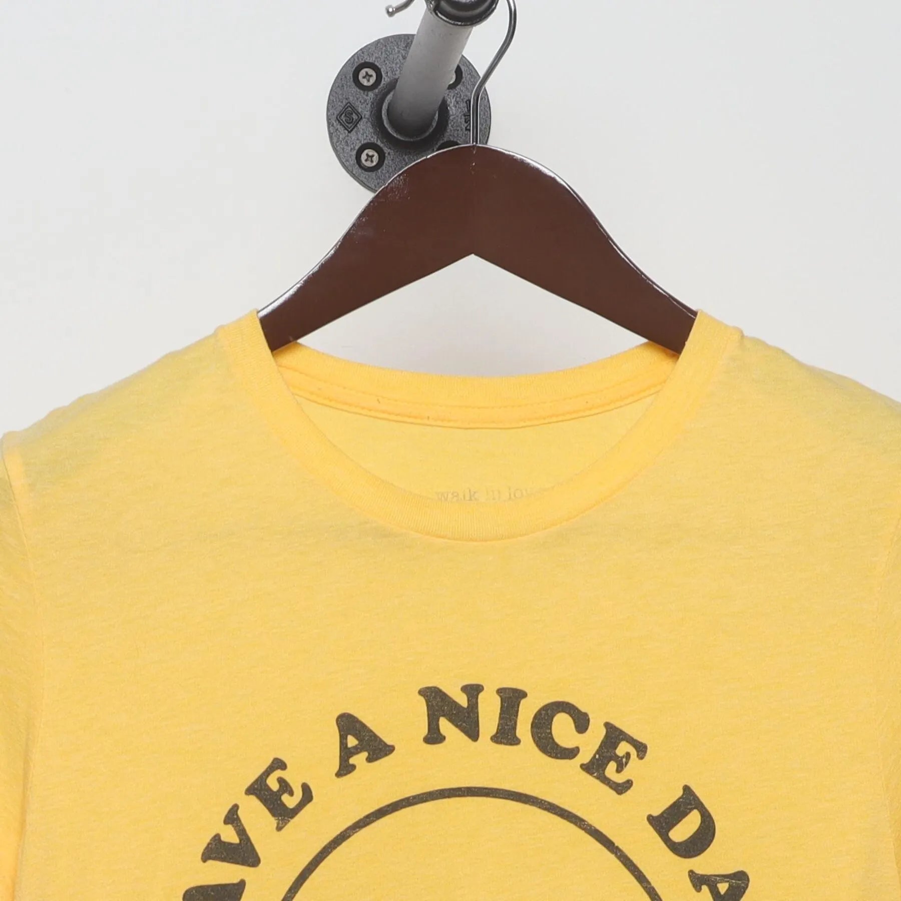 Close-up of the collar and tag on the Vintage 1970s walk in love. "Have A Nice Day" Smiley Face T-Shirt - XS