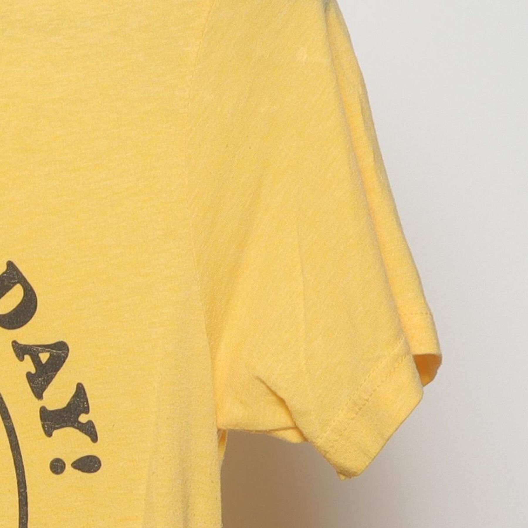 Close-up of the Right sleeve on the Vintage 1970s walk in love. "Have A Nice Day" Smiley Face T-Shirt - XS