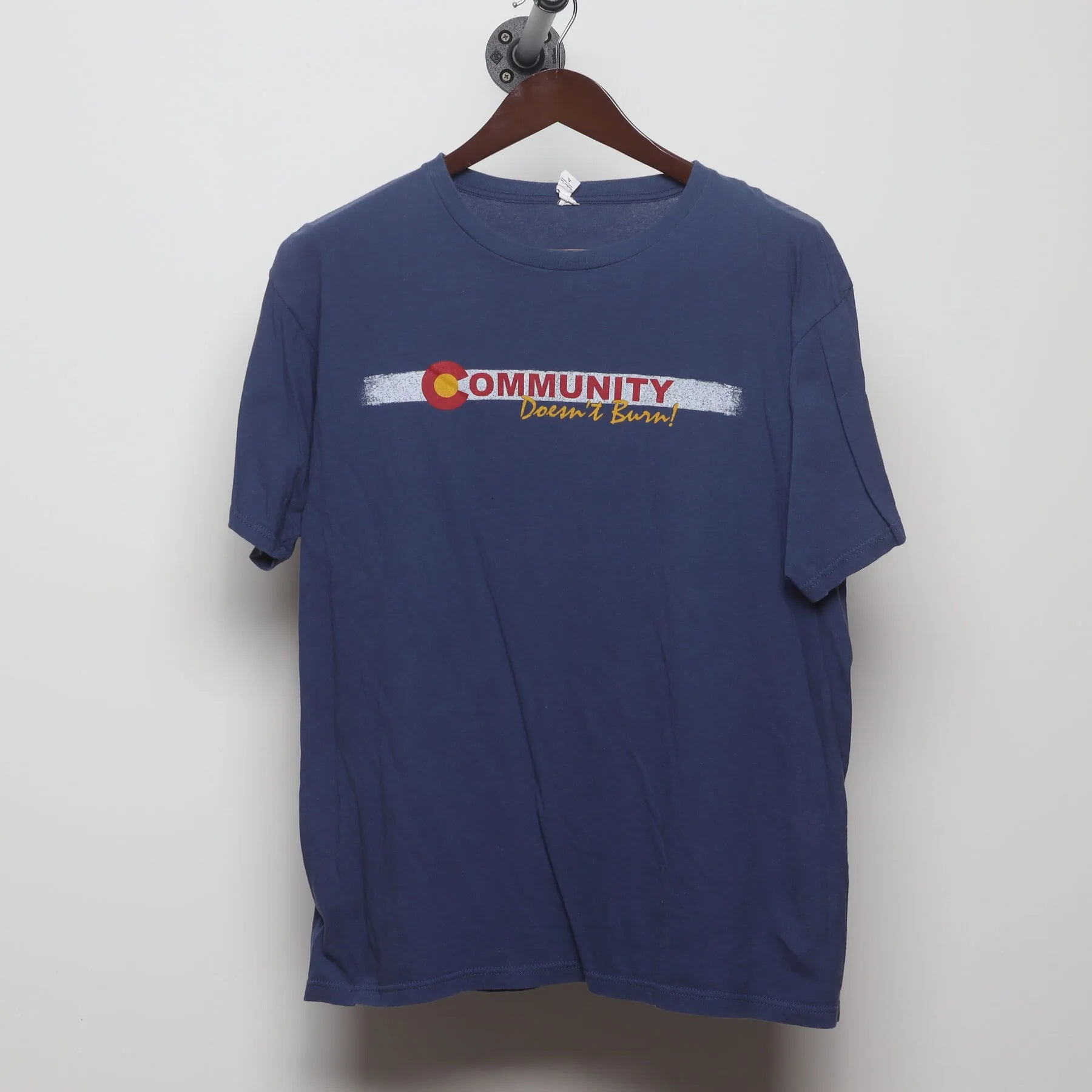 Front view of Vintage Y2K Community "Doesn't Burn" T-Shirt - L