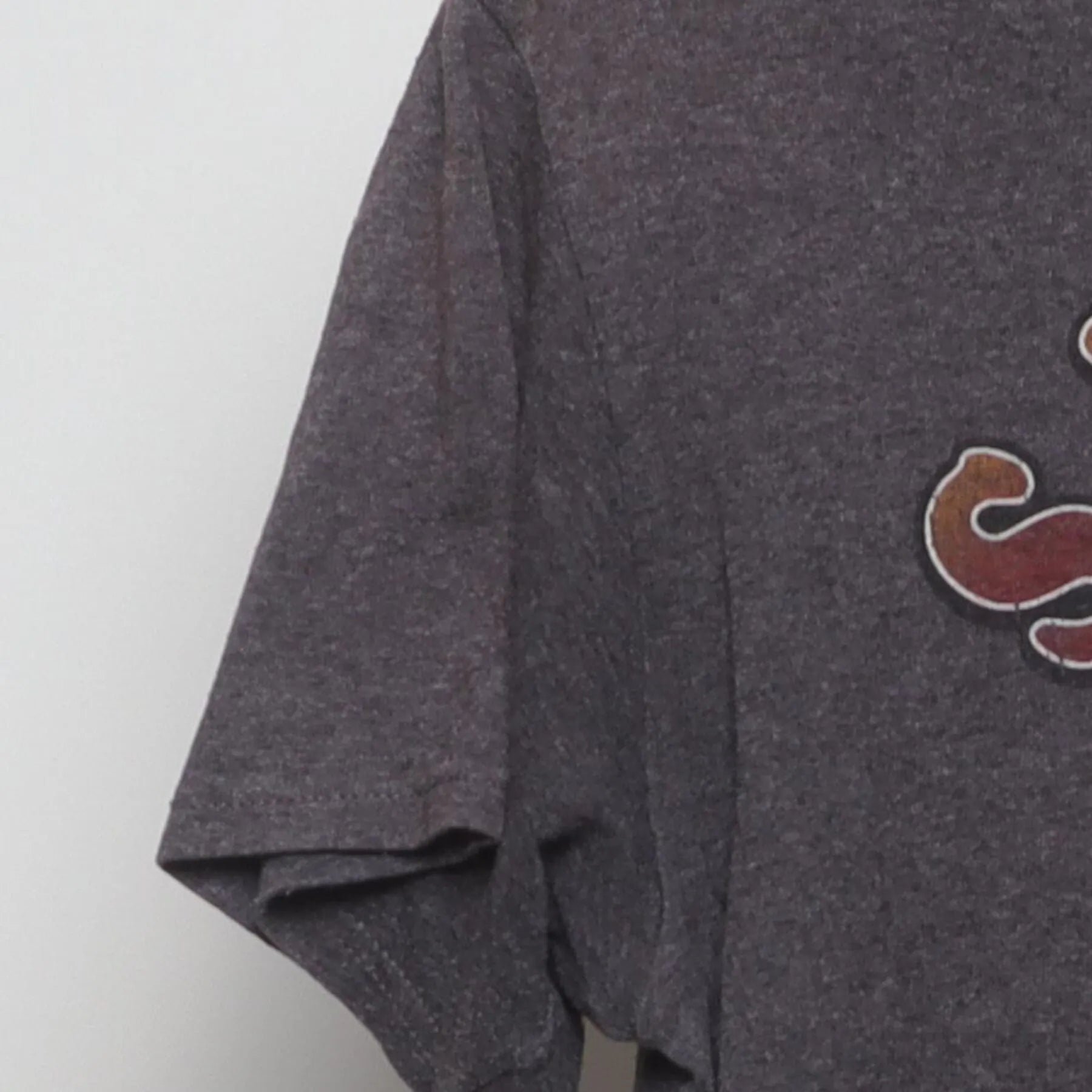 Close-up of the Left sleeve on the Vintage 1990s Looney Tunes "Sarcasm Service" T-Shirt - S
