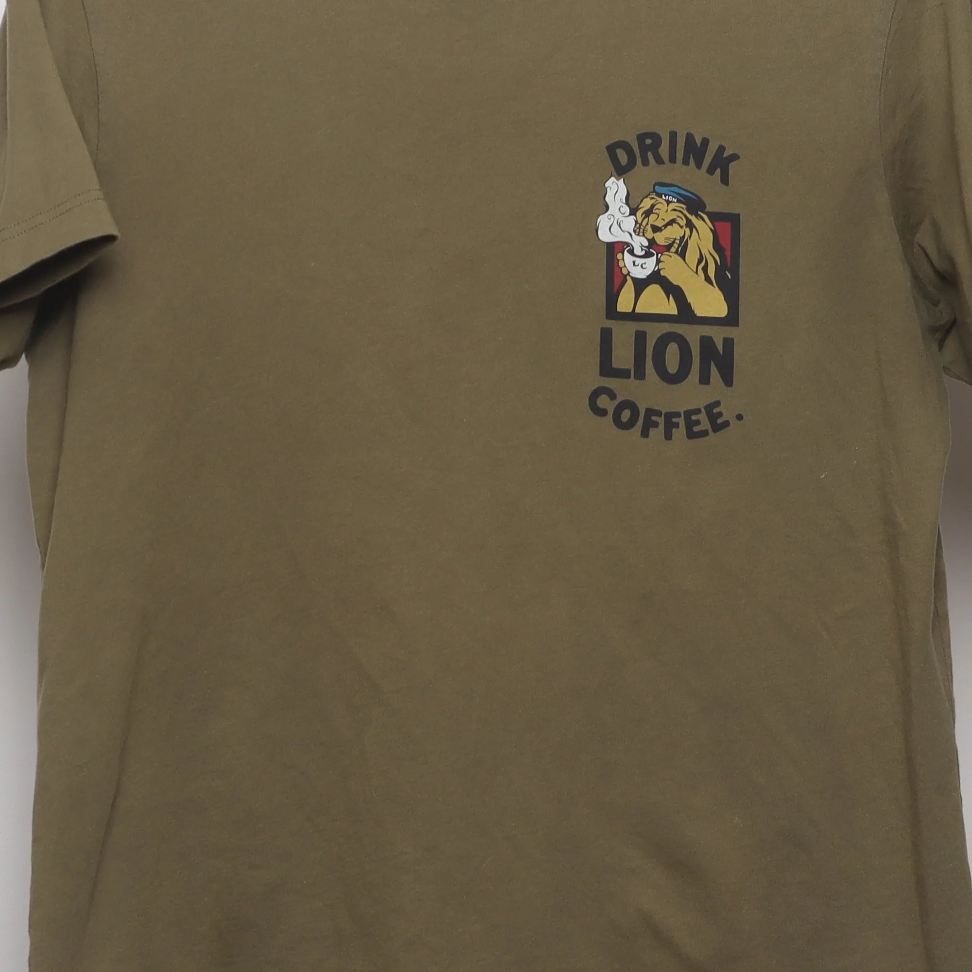 Close-up of the main graphic on the Vintage-Style Uniqlo UT Lion Coffee Graphic T-Shirt M